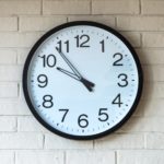 clock on brick wall